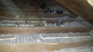 Image of an attic before air sealing.