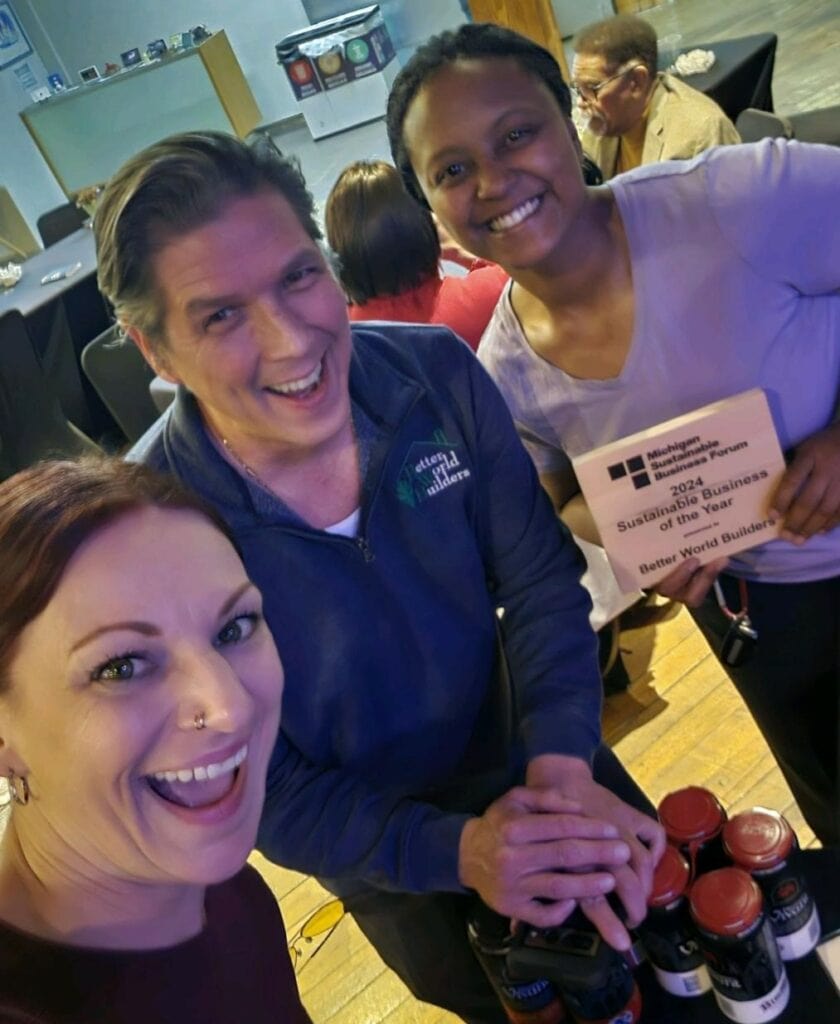 Better World Builders crew members, Al-Lanna Jones and Stacy Waters, joined President Mark Lee to receive the 2024 Sustainable Business of the Year Award, presented by the Southwest Michigan Sustainable Business Forum.