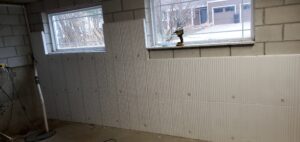 Image of dense insulation foundation panels during installation.