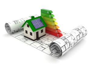 Image of miniature house with roof solar panels, on top of blueprints.