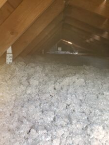 Image of cellulose insulation in attic.