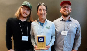 bwb-about-team Owner, Mark Lee, and Better World Builders team members with their Residential Project of the Year award from MEECA