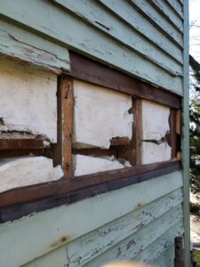 Image of exterior wall retrofit with failed injection foam.